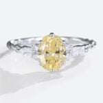 1.5ct Fancy Yellow VS+ Oval Cut Lab Grown Yellow Diamond Twisted 6-Prong Engagement Ring (2)