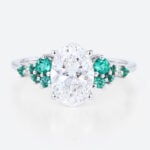 1.5ct Oval Cut Lab Diamond Engagement Ring with Lab Emerald Side Stone Ring in White Gold