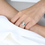 1.5ct Oval Cut Lab Diamond Engagement Ring with Lab Emerald Side Stone Ring in White Gold