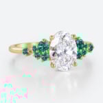 1.5ct Oval Cut Lab Diamond Engagement Ring with Lab Emerald Side Stone Ring in Yellow Gold