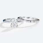 Oval Cut Moissanite Solitaire Bridal Ring Set with Straight Stacking Band in white gold
