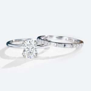 Oval Cut Moissanite Solitaire Bridal Ring Set with Straight Stacking Band in white gold