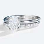 Oval Cut Moissanite Solitaire Bridal Ring Set with Straight Stacking Band in white gold