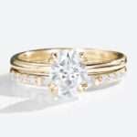 Oval Cut Moissanite Solitaire Bridal Ring Set with Straight Stacking Band in yellow gold