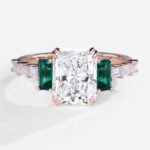 1.5 Carat Lab Diamond Double Claw Ring Emerald Side Stone in Rose Gold