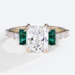 1.5 Carat Lab Diamond Double Claw Ring Emerald Side Stone in Rose Gold