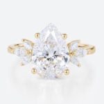 2ct Colorless VS+ Pear Cut Lab Grown Diamond Wing-Inspired 4-Prong Engagement Ring in Yellow Gold