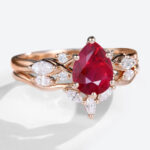 Rose Gold 1.2ct Pear Shaped Lab Grown Ruby Ring Sets with Curved Wedding Band