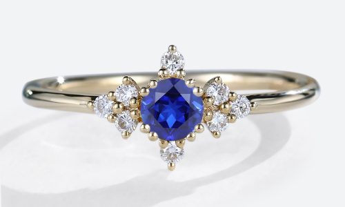 Round Cut Lab Created Blue Sapphire Rings Symmetrical Design Bridal Ring in Yellow Gold