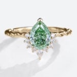 1ct Pear Shaped Lab Green Diamond Ring Twisted 3-Prong Engagement Ring in Yellow Gold