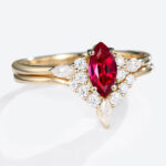 0.5ct Marquise Cut Lab Ruby Ring Set with Curved Wedding Bands in Yellow Gold