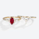 0.5ct Marquise Cut Lab Ruby Ring Set with Curved Wedding Bands in Yellow Gold