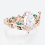 1ct Pear Cut Lab Diamond Bridal Ring Set with Nature-Inspired Emerald Side Stone in Rose Gold