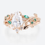 1ct Pear Cut Lab Diamond Bridal Ring Set with Nature-Inspired Emerald Side Stone in Rose Gold