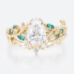 1ct Pear Cut Lab Diamond Bridal Ring Set with Nature-Inspired Emerald Side Stone in Yellow Gold