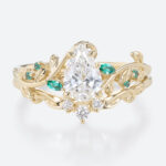 1ct Pear Cut Lab Diamond Bridal Ring Set with Nature-Inspired Emerald Side Stone in Yellow Gold