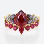 1.2ct Pear Shaped Ruby Engagement Ring Set with Curved Band in Yellow Gold