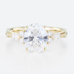 Oval Lab Grown Diamond Engagement Ring with Floral Side Stones in Yellow Gold