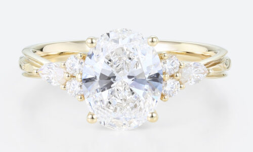 Oval Lab Grown Diamond Engagement Ring with Floral Side Stones in Yellow Gold