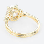 Oval Lab Grown Diamond Engagement Ring with Floral Side Stones in Yellow Gold