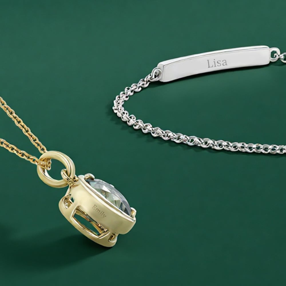 A customized green and a blue gemstone necklace and a customized bracelets, each engraved with the customer's name