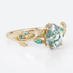Nature-Inspired Pear Cut Moss Agate Ring​ with Emerald Accents in Yellow Gold