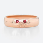 Round Cut Ruby Ring Wide Band Ring with Engraved Skull Design in Rose Gold
