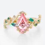 Kite Cut Nature-Inspired Pink Sapphire Ring with Emerald Leaf Accents in Yellow Gold
