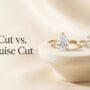 Pear-shaped and marquise-cut diamond engagement rings displayed side by side
