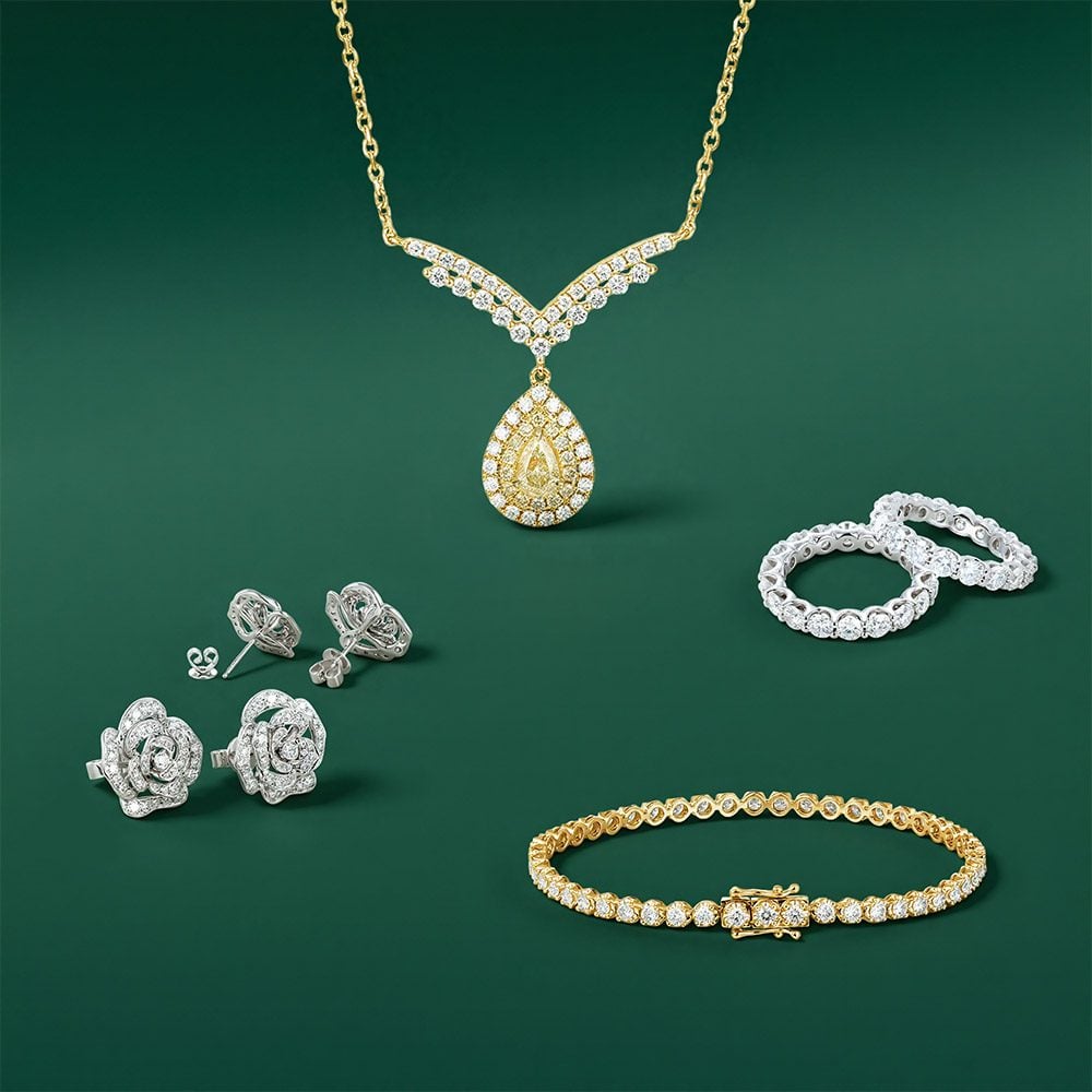 Tennis bracelets, lab yellow diamond necklace, flower stud earrings and full eternity bands.